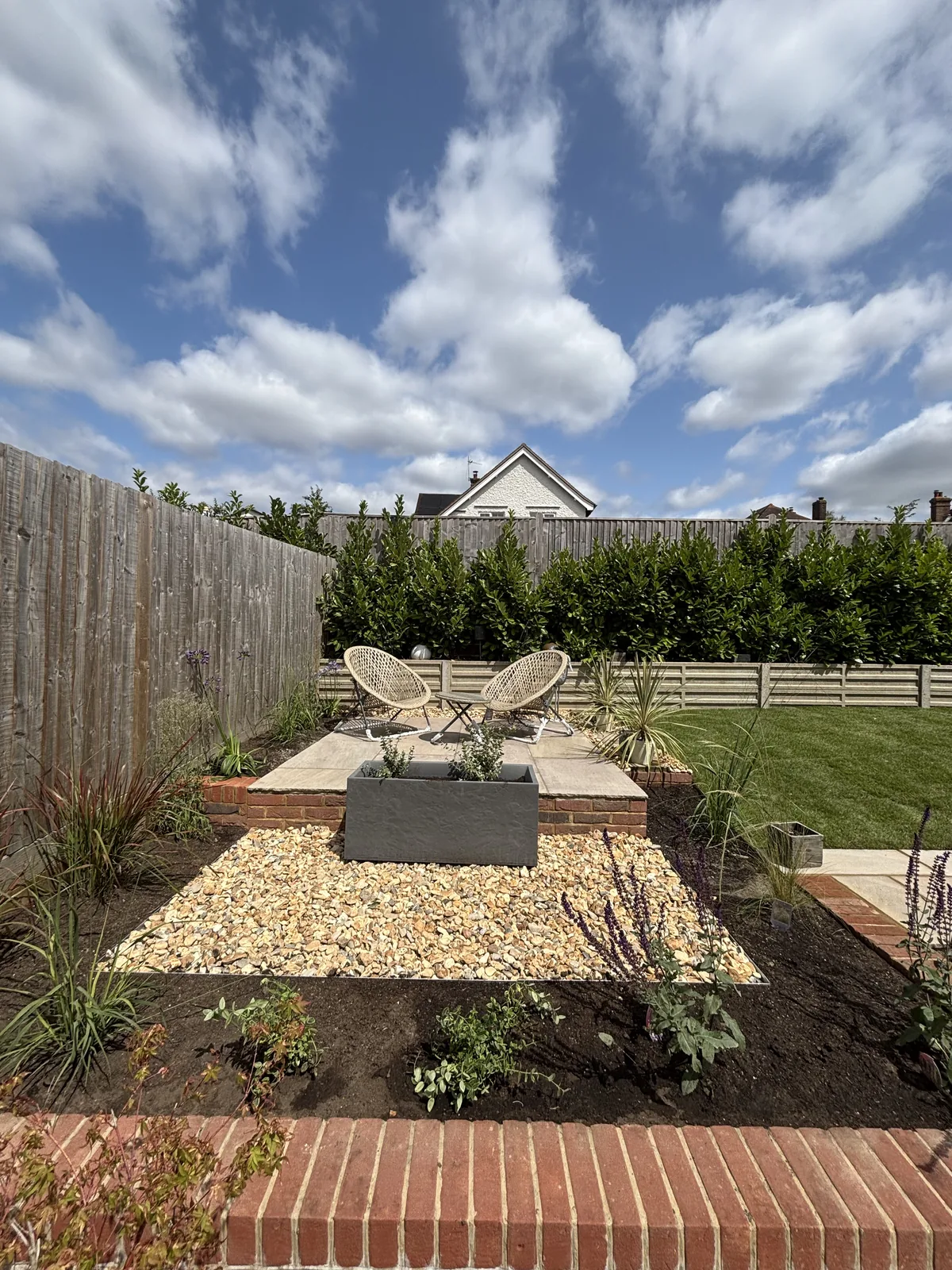 Slate planter set as a centrepiece in the gravel seating area
